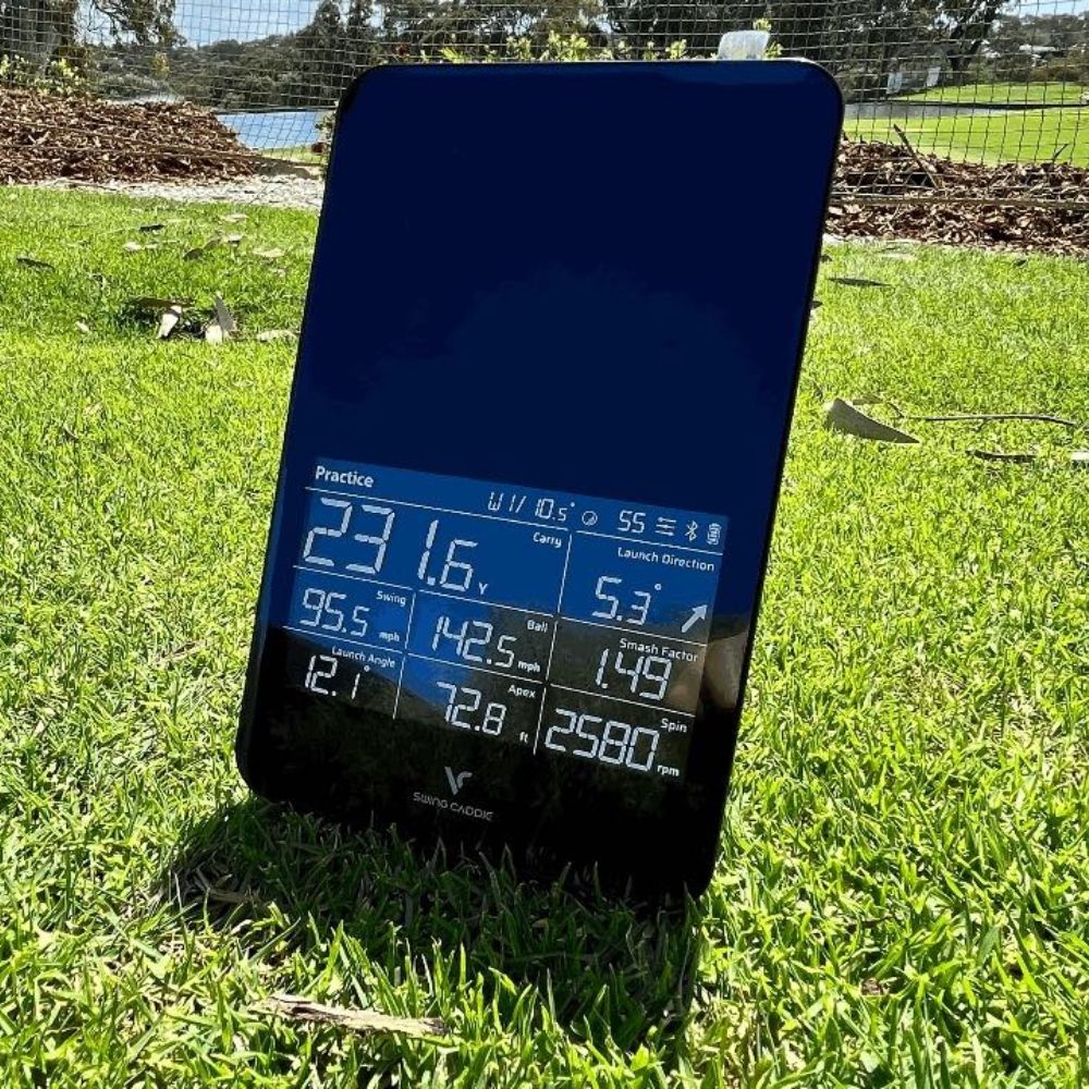 Close_up_of_sc4_launch_monitor on grass with screen turned on